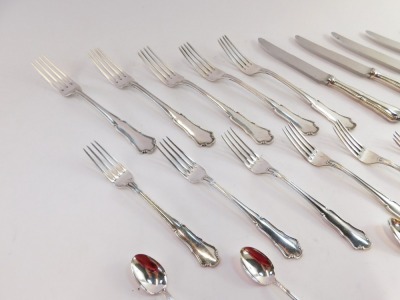 An Italian part table service, comprising a set of table knives and forks, each shell pattern, marked 800., together with a set of pickle forks and spoons, with similar markings, with dust protectors, 33.99oz all in. - 2