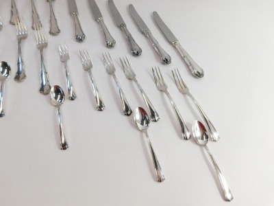 An Italian part table service, comprising a set of table knives and forks, each shell pattern, marked 800., together with a set of pickle forks and spoons, with similar markings, with dust protectors, 33.99oz all in. - 3