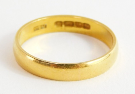 A 22ct gold thin wedding band, Birmingham 1910, ring size O½, 1.9g.