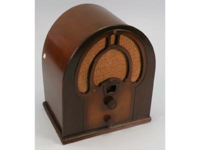 A Philco Junior radio in an arched walnut veneered case with