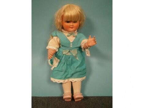 An early plastic moving eye Cinderella No. 3 doll wearing a turquoise dress