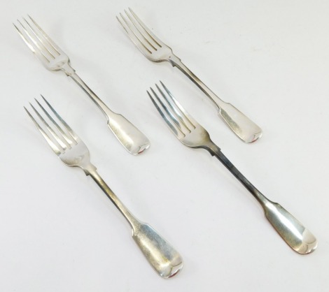 A set of four silver Victorian fiddle pattern dessert forks, initial engraved within a garter, London 1843, 7½oz.