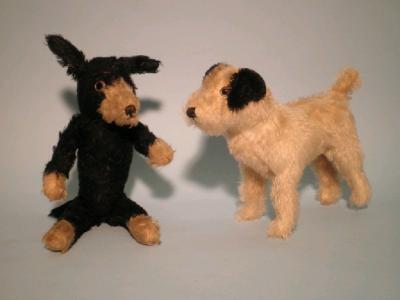 A 1920's/30's black teddy bear with cream nose