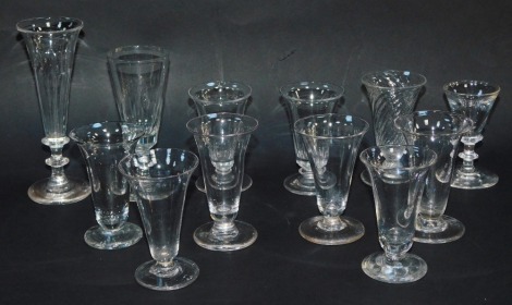 A group of 19thC and later wine and syllabub glasses, varying designs, together with a deceptive glass. (12)