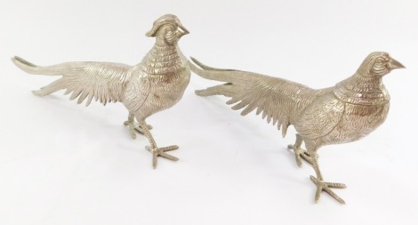 A pair of silver plated pheasants, marked Firenze, 23cm long, 13cm high.