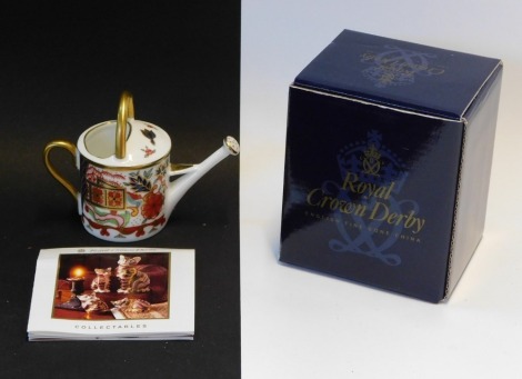 A Royal Crown Derby Miniatures Collection watering can, boxed, 7cm high.