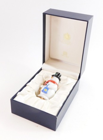 A Halcyon Days enamels snowman pill box, 9cm high, boxed.