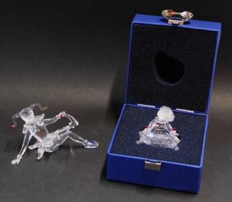 Two Swarovski Crystal ornaments, comprising seated jester, with certificate, 9cm high, and a Swarovski Crystal seated ballerina, 5cm wide, both boxed.