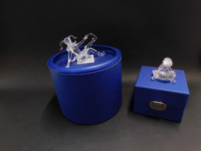 Two Swarovski Crystal ornaments, comprising seated jester, with certificate, 9cm high, and a Swarovski Crystal seated ballerina, 5cm wide, both boxed. - 2