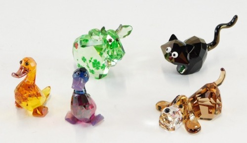 Four Swarovski crystal ornaments, comprising moose with bell, dog, pair of ducks, and cat, all boxed. (4)