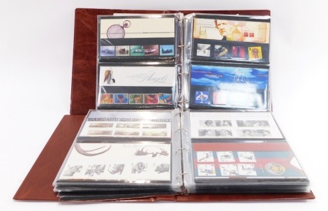 Two albums of Royal Mail presentation packs and first day covers, to include Christmas, farm animals, Harry Potter, Classics, The Ashes, and others. (2 albums)