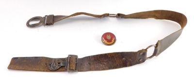 A leather boy scout belt, and a red enamel boy scout fox pin. (2)