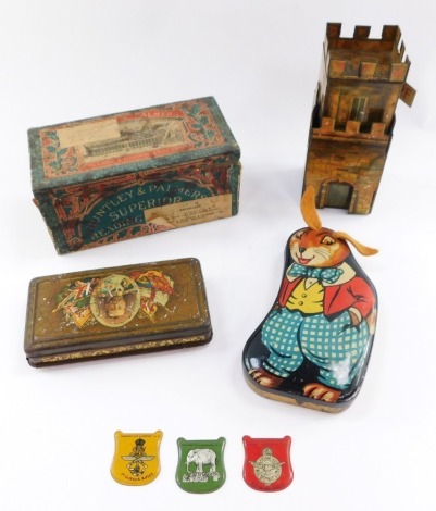 A Peek Freans tin plate castle biscuit tin, George V Coronation cigarette and matches tin, Huntley & Palmers Superior Breakfast biscuit tin, George Horner Dainty Dinah special assortment rabbit tin, and three military car badges. (7)