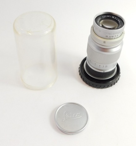 An Ernst Leitz Leica Elmar 9cm screwfix lens, Nr 1381453, in keeper case.