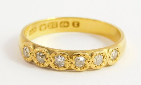 A 22ct gold diamond six stone ring, approx 0.2cts, size R, 3.9g.