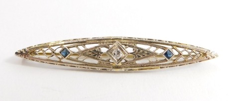 An Art Deco sapphire and diamond brooch, of lozenge form, set in pierced yellow and white metal, stamped 14k, 3.9g.