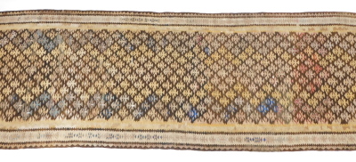 A Caucasian brown ground runner, decorated with vary coloured tree motifs, within geometric borders, 265cm x 97cm. - 2