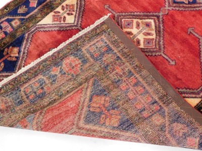 A Persian Koliai - Kurdi carpet, red ground decorated with four central guls, flanked by half guls within geometric and floral borders, 248cm x 150cm. (with certificate) - 6