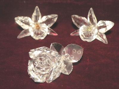 A Swarovski Silver Crystal rose and two orchids