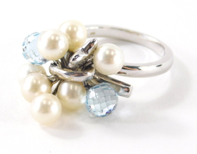 An 18ct white gold pearl diamond and blue topaz set dress ring, with cluster design of two pale blue topaz, and six pearls with a single star drop, ring size O½, 9.1g all in. - 2