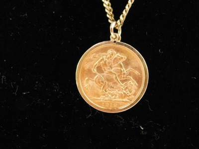 A George V full gold sovereign pendant and chain, dated 1912, on curb link chain marked 9ct, 60cm long, 22.1g all in. - 6