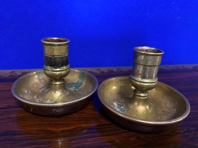 A pair of Victorian campaign chambersticks or "Brighton Buns", leather covered with male and female candle sockets, selected by TV celebrity Susan Calman.NB. This is a charity lot and there is no Buyers Premium payable. Collection is from The Lincoln Auct