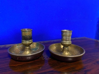 A pair of Victorian campaign chambersticks or "Brighton Buns", leather covered with male and female candle sockets, selected by TV celebrity Susan Calman.NB. This is a charity lot and there is no Buyers Premium payable. Collection is from The Lincoln Auct - 2