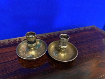 A pair of Victorian campaign chambersticks or "Brighton Buns", leather covered with male and female candle sockets, selected by TV celebrity Susan Calman.NB. This is a charity lot and there is no Buyers Premium payable. Collection is from The Lincoln Auct - 3