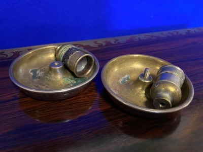 A pair of Victorian campaign chambersticks or "Brighton Buns", leather covered with male and female candle sockets, selected by TV celebrity Susan Calman.NB. This is a charity lot and there is no Buyers Premium payable. Collection is from The Lincoln Auct - 4