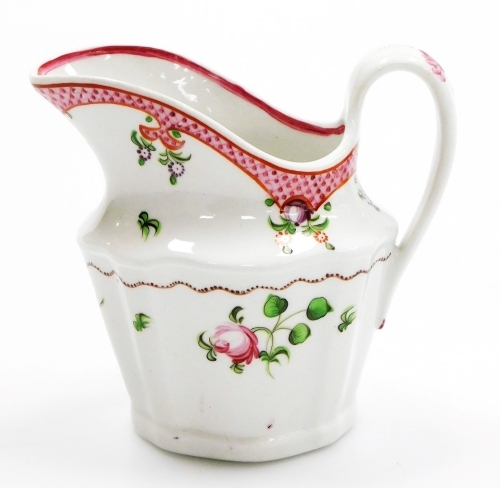 An early 19thC Newhall porcelain cream jug, with sprigs of flowers and pink scale border, pattern number 173, circa 1796-1805, 11cm high.