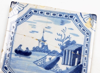 Two English Delft blue and white tiles, an 18thC Liverpool tile depicting ship and lake scene, 12.5cm x 12.5cm, (AF), and a Lambeth Delft plaque with maiden carrying basket, 12.5cm x 12.5cm. (2) - 3