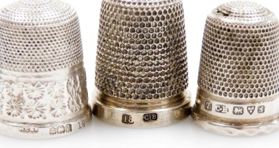 A group of nine silver thimbles, each of varying design, some in thimble cases, 2½oz. - 2