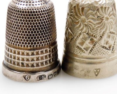 A group of twelve silver thimbles, each of varying design, some in thimble cases, 3½oz. - 4