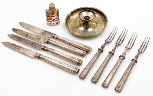 A collection of small silver and white metal, to include a white metal mounted scent bottle, decorated with leaves, flowers, etc., 5cm high, a quantity of silver handled dessert knives and forks, etc. (a quantity)