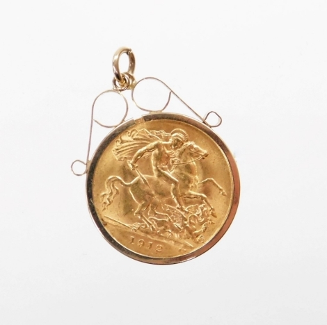 A George V half gold sovereign pendant, dated 1912, with a 9ct gold pendant mount, 4.8g.