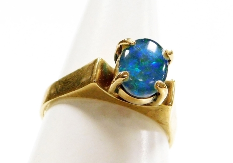 A 9ct gold opal dress ring, with single opal in four claw raised setting, stamped 9ct, ring size N, 3.1g all in.