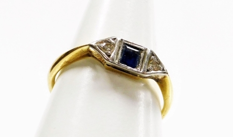 An Art Deco style dress ring, the central design set with square cut sapphire and two tiny diamonds, in illusion platinum setting, on a yellow metal band, marked 18ct, ring size L, 2g all in.