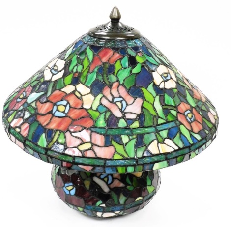 A Tiffany style table lamp, heavily decorated with flowers, with metal mounts and electrical fitting, 49cm high.