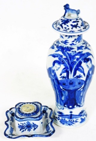 A 19thC Chinese porcelain vase, of inverted shouldered circular form, profusely decorated with figures in exterior setting, before flowers, on a circular foot, four character mark beneath, 29cm high, and a Dutch Delft tin glazed inkwell, marked beneath. (