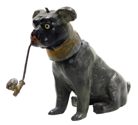 A late 19thC cold painted spelter nodding pug, in a seated pose holding pipe in its mouth, 7.5cm long.