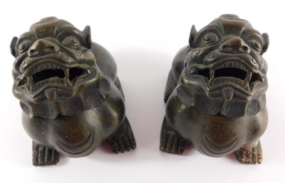 A pair of Chinese bronze incense burners, cast as dogs of fo with removable heads, bearing four character mark "Da Qing nian zhi", 12.5cm wide. - 5