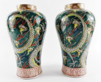 A pair of Chinese porcelain vases, of Meiping form, decorated with dragons chasing flaming pearls, above diaper borders, 25cm high. - 3