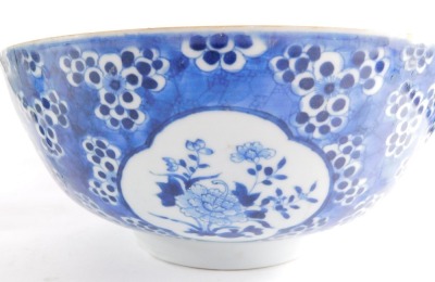 A Chinese porcelain blue and white bowl, decorated with the reserves of figures, and flowers, on a prunus blossom and cracked ice ground, probably 18thC, 26cm diameter, together with a Canton celadon ground dish, decorated centrally with a reserve of ladi - 3