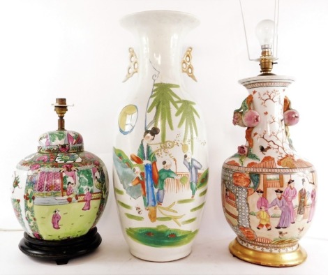A Chinese Republic famille rose porcelain vase, of shouldered ovoid form, with twin pomegranate moulded handles, the reserves decorated with courtyard scenes, beneath cockerels and blossom, converted to a table lamp, 43cm high, a Canton porcelain jar and 