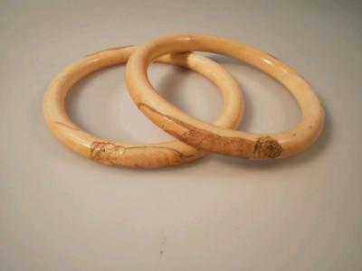 Two carved ivory bangles