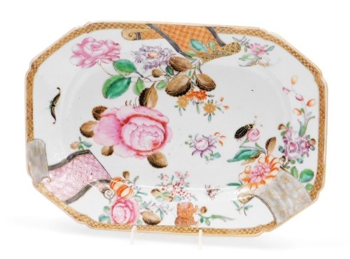 An 18thC Chinese porcelain octagonal serving platter, enamelled with peonies, insects and butterflies, diaper border with three scrolls, all in tones of pink, green, orange brown and gilt, 29cm wide.