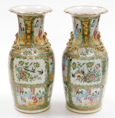 A pair of 19thC Chinese Canton porcelain baluster vases, with gilt kylin handles and applied chilin to the shoulders, decorated with panels of figures at court, birds, flora, and insects, in a famille rose palette, 46cm high. - 2