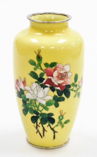 A 20thC Japanese silver wire cloisonné baluster vase, decorated with red and white roses on a yellow ground, 21cm high.