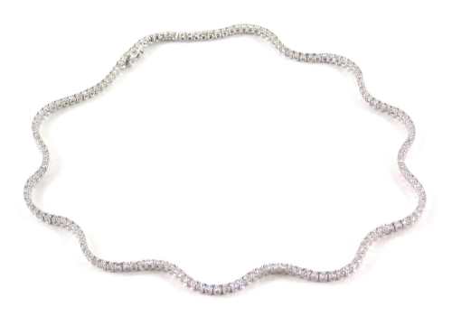 A Wempe diamond waveline necklet, set with one hundred and sixty six graduated round brilliant cut diamonds each in four claw setting, with bolt and tong clasp with safety clip, the diamonds approximately 2.2mm-2.5mm diameter, total estimated carat weight