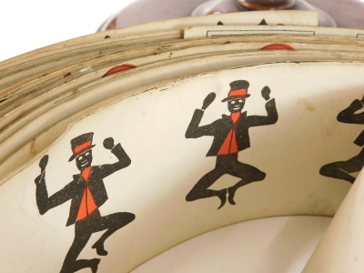 A 19thC mahogany and metal Zoetrope, the upper cylinder with a selection of various paper reels, to include fish and birds, various figures, some titled to include a Jolly Dog, Who's That Knockin At The Door, etc., some possibly later, 30cm diameter. - 2